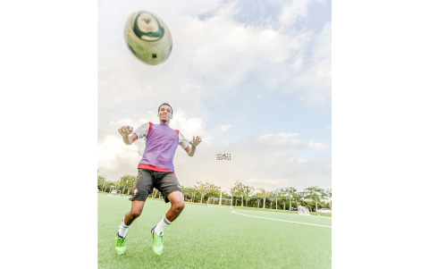 Jahdean Andre Alexander practices at the Arie Smith Football Camp at Camana Bay’s Sports Complex on Dec. 21. - PHOTO: MATT LAMERS