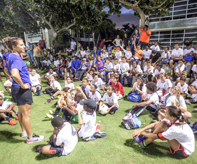 Carli Lloyd wows youth at football camp