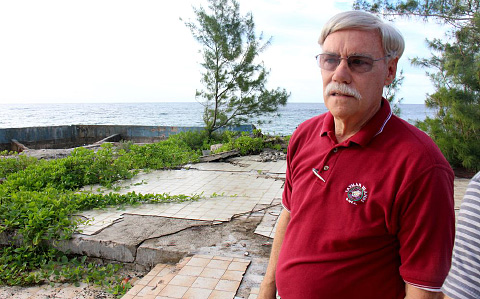 Jim Keim stands in what used to be the living room of his rental property at Mariner