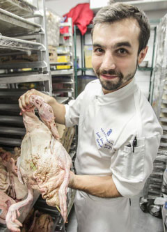 Chef Lucas Julien-Vauzelle with one of the 25 Peking ducks that will be served up at on Christmas Day.