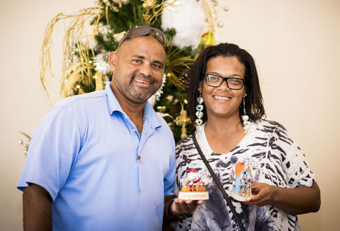Waldo Parchment and Arlene Parker with the Christmas gifts they received from Jerry and Pam Reding. - PHOTO: TANEOS RAMSAY