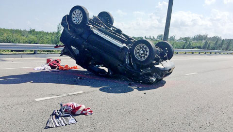 A pregnant West Bay woman was fortunately not seriously injured in this rollover that occurred Saturday, Dec. 19. - PHOTO: TANEOS RAMSAY