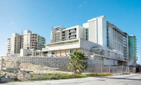Construction work on Dart’s 10-story Seafire Resort and Spa hotel on Seven Mile Beach is continuing apace. – PHOTO: TANEOS RAMSAY