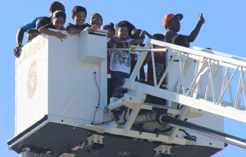 A ride in a fire truck  bucket was a thrill for youngsters.