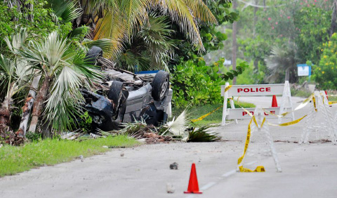Two men were killed, and another injured, when this Honda Odyssey van overturned along South Side Road East in Cayman Brac on Nov 15. - Photo: Ed Beaty