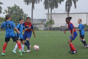 Cayman Prep, front left foreground and rear right, came third in the Girls Championship after beating Triple C in a penalty shootout.