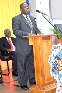 Acting Police Sergeant Cornelius Pompey addresses graduates during the UWI ceremony.
