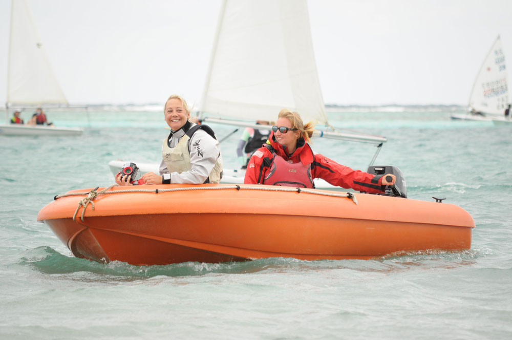 Karin McGrath, CISC communication representative, left, and Coach Rebecca Calvert man the safety boat during the regatta.