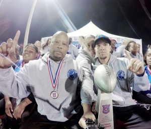 Cayman Flag football national team coaches Brendon Malice, right, and Clayton Lopez with the trophy.