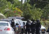 Armed police officers storm Newlands house