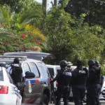 Armed police officers storm Newlands house