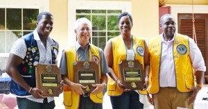 From left, Melvin Jones Fellows Jerrique Seymour, Andrew Hulse, Cordella Chollette and President Ewan Jacques.