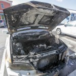 Car fire forces road closure