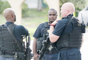 Uniform Support Group officers respond to a call in September 2015. Some USG officers have been put on regular patrol shifts this year as part of a police department reorganization. - Photo: Taneos Ramsay