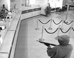 George Mignott, seen in an image from CCTV recorded during the robbery of Cayman National Bank, was sentenced to 12 years in prison for his role in the crime.