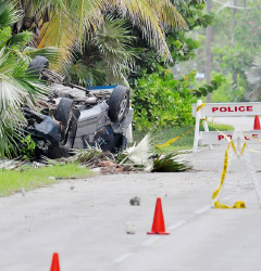 Two men were killed, and another injured, when this Honda Odyssey van overturned along South Side Road East in Cayman Brac on Nov 15. - Photo: Ed Beaty