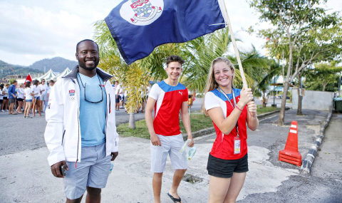 Coach Raph Harvey accompanies Pablo Bertran and Florence Allan at the opening ceremony of the 2015 Youth Sailing World Championships.