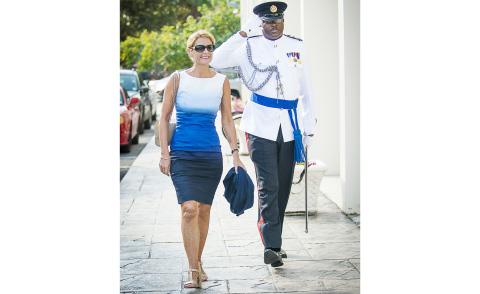 Governor Helen Kilpatrick arrives at the Law Courts Building accompanied by Inspector Ian Yearwood.