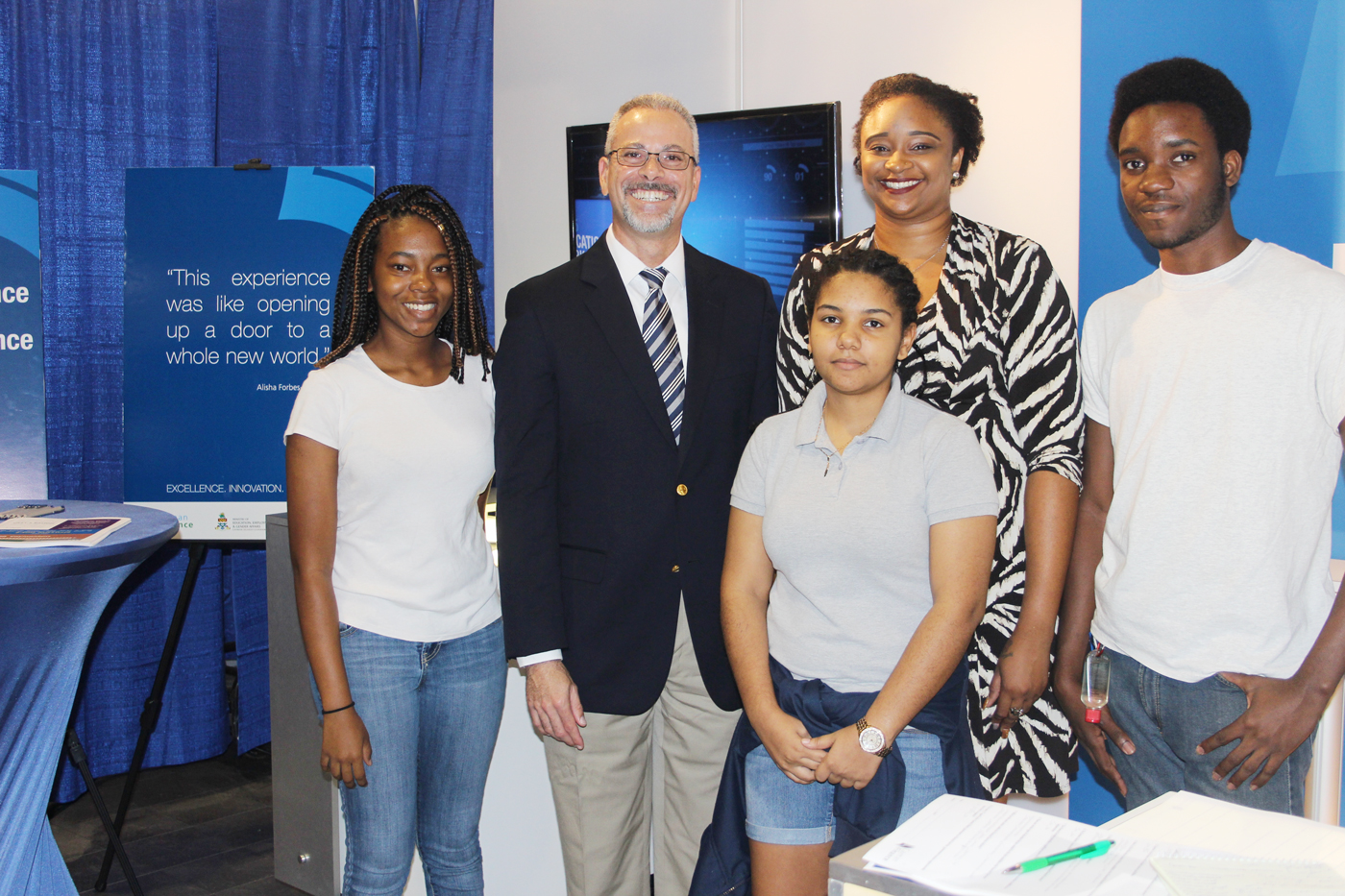 Students Catherine Haye, Jovanna Ebanks and Carl Lewis take part in the career expo with Jude Scott and Leanna Jarvis of Cayman Finance.