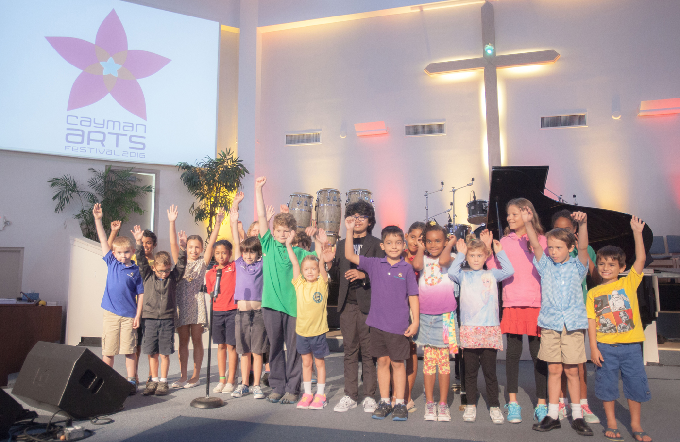 Joey Alexander, 12, with young fans after his concert in Cayman. Throughout the performance the audience had an opportunity to pepper the young musician with questions. - Photos: Matt Lamers