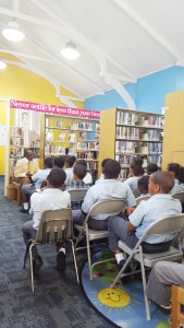 Attorney Steve McField speaks with children at a Black History Month event at the East End Public Library.