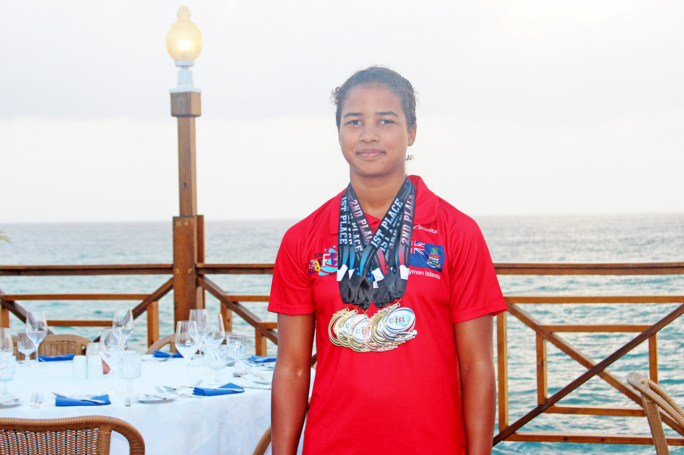 Alison Jackson is no stranger to the CARIFTA Games. She is shown here with the many medals she won at last year's games.
