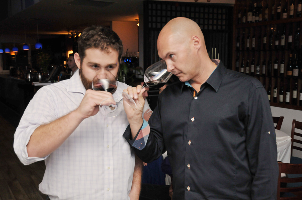 Ross Chernin, left, and Lee Royle smell their wines during the first blind tasting. Photo: Alan Markoff