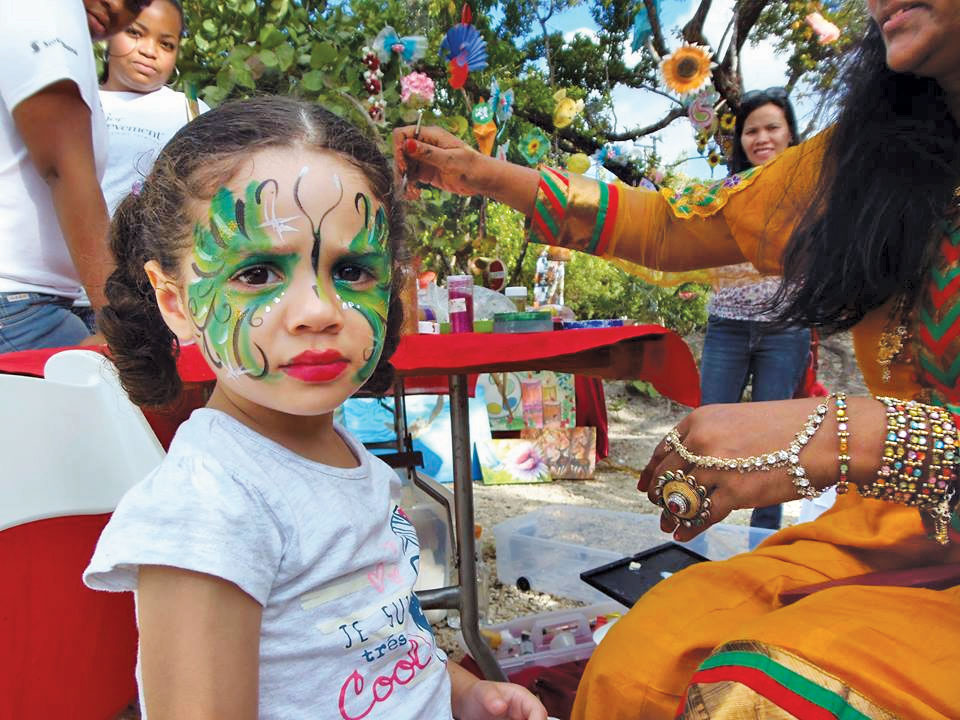 Someone's not too sure about having her face painted.
