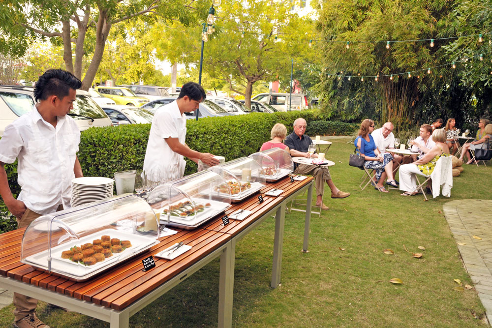 The SWIRL wine tasting out on the green by the Wicket Bar also featured canapes that reflected the Greek and Sicilian themes of the wine. - Photo: Alan Markoff