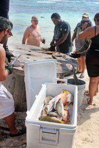 Fishermen typically draw a crowd eager to see the catch of the day.