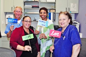 Members of the HSA chemotherapy team, from leftt, Andrew Ward, Karen Pinnock, Rosanna Humphries and Cyndy Ebanks, at the World Cancer Day art exhibit.