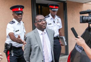 Canover Watson is led from court at Kirk House to the law courts building downtown. He was later transferred to Northward Prison on Thursday after being found guilty of five counts of corruption-related charges. – PHOTO: MATT LAMERS
