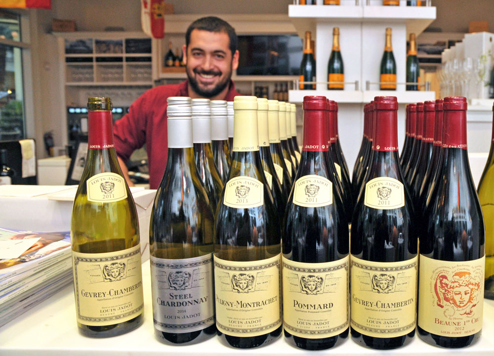 The wines of Louis Jadot presented at the first Master Somm Series event at West Indies Wine Company, with store manager Brandon Copico in the background. – Photos: Alan Markoff