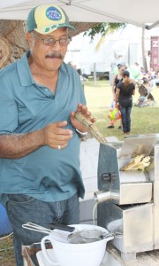 Avery Eden demonstrates cane juice making.