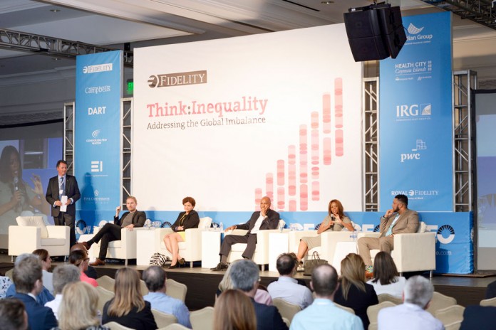 Moderator Jeremy Hurst, author Rasmus Ankersen, Minister Tara Rivers, Paul Byles, economist Dambisa Moyo and Health City marketing director Shomari Scott, during a panel disucssion at the Cayman Economic Outlook session, ‘Think: Inequality.' – Photo: David Wolfe Photography