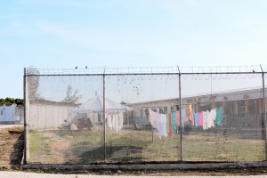 The Immigration Detention Centre in central George Town is packed full again, but officials are no longer having to put migrants in local community centers. – Photo: Brent Fuller