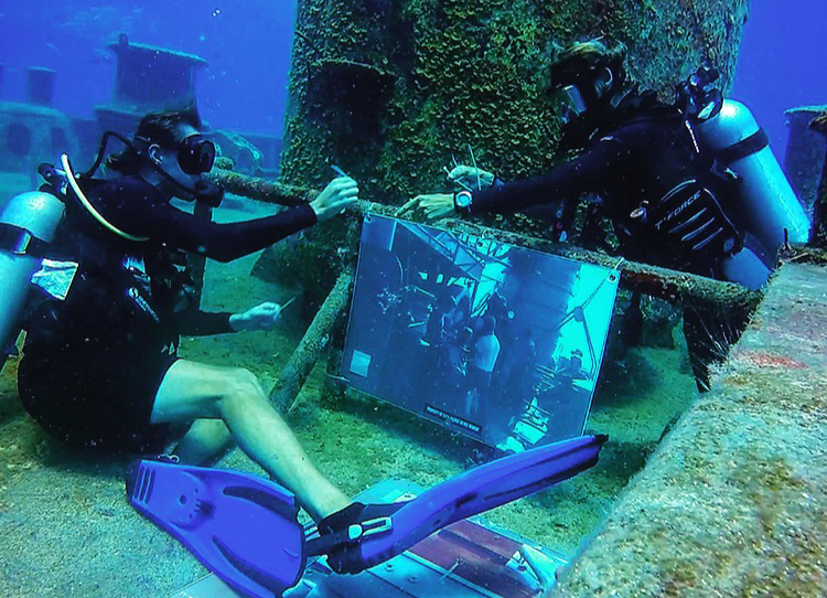 Divers mount one of several photos for the Kittiwake’s 5th Anniversary of the sinking celebratory underwater museum. Photos are still being mounted and finalized over the next few weeks.