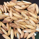Sharing Cayman tradition: cracking almond seeds