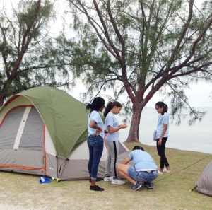 Guides set up camp at Water Cay Public Beach in Cayman Kai in February.