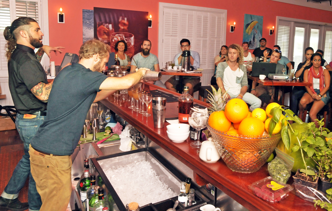 Jacques Scott’s Simon Crompton mixes up cocktails while Diageo Brand Ambassador Mario Seijo explains techniques during a mixology master class at George Town Yacht Club. – Photos: Alan Markoff