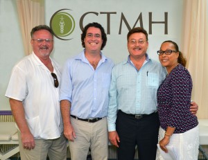 From left, David Pellow, Dr. Yaron Rado, Dr. Steve Tomlinson and Nadine Tomlinson-Brown announce the sale of Chrissie Tomlinson Memorial Hospital on Wednesday.