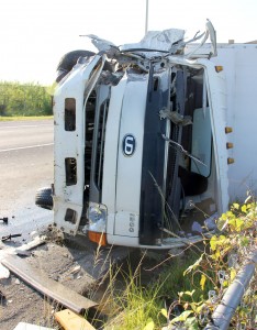 The truck driven by Fitzroy Marin Roach lies on its side following the Oct. 16, 2012 crash in which taxi driver Bevereley Ramsay was killed. - PHOTOS: TANEOS RAMSAY