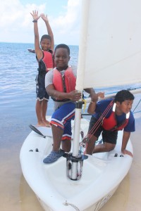 Jerrol Derby, Dejaun Powis and Marcus McField make their way to shore in the dinghy. - Photos: Jewel Levy