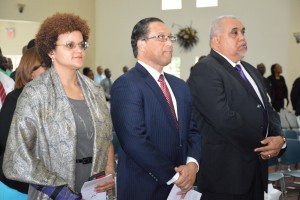 Premier Alden McLaughlin, center, with government ministers Tara Rivers and Osbourne Bodden at Saturday's church service for Honoring Women Month.