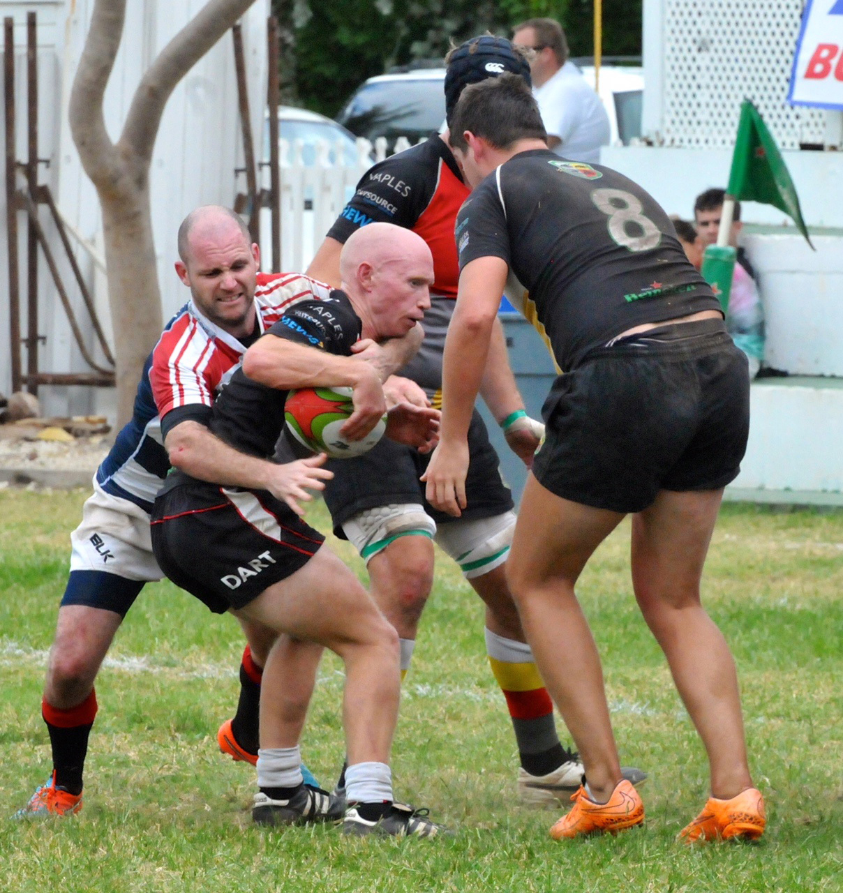 Neil Montgomery takes on David Stringer in the National Team's defeat of Cayman Club Select last week.