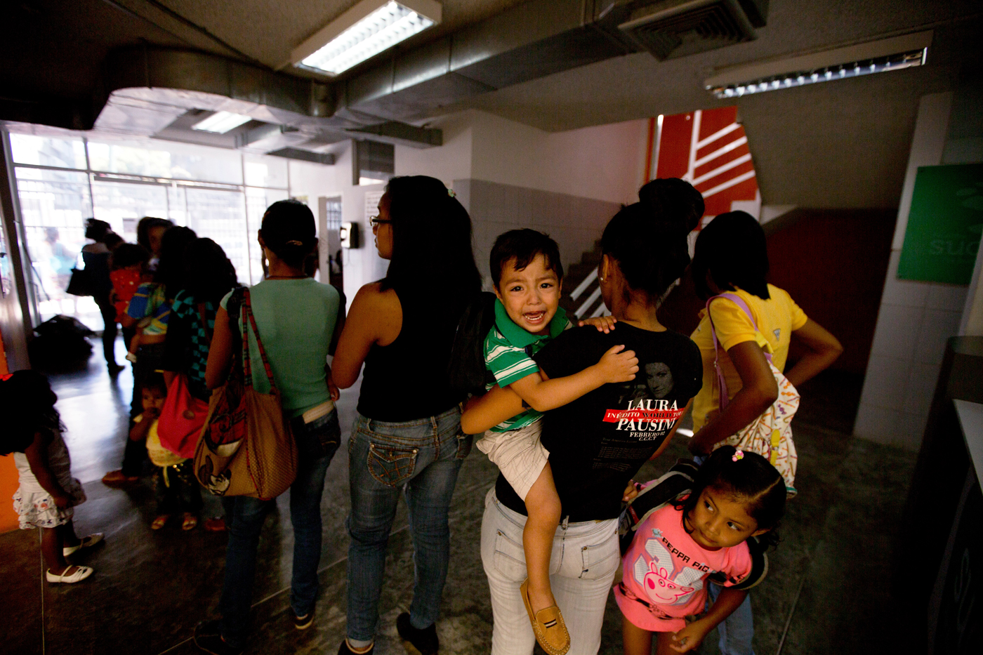 People line up to see a doctor at a medical center in Caracas, Venezuela. Preventing the Zika virus's spread in the absence of a public campaign in the country, where the healthcare system is near collapse, means that the people most at risk don't even know about the virus. - Photo: AP