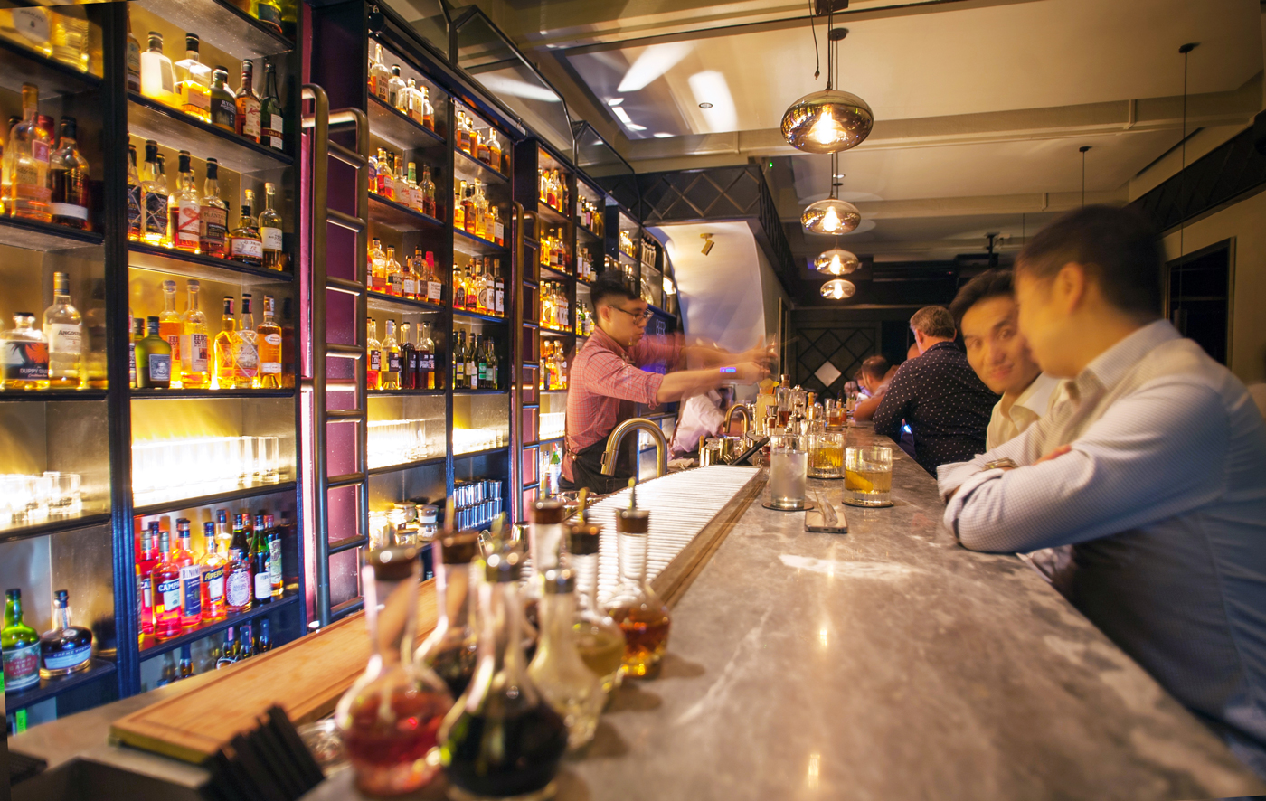 Patrons take coveted seats at the bar where reservations are highly recommended. - Photo: Dylan Benoit