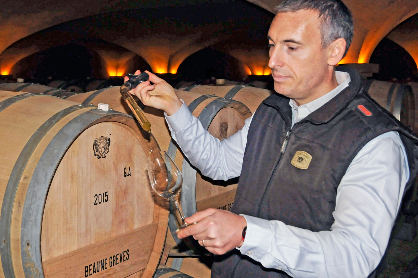 Maison Louis Jadot winemaker Frédéric Barnier tastes one of the many 1er cru and grand cru wines in the winery's cellar.