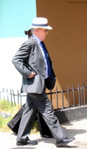 Justice Charles Quin walks the scene around the Globe Bar.