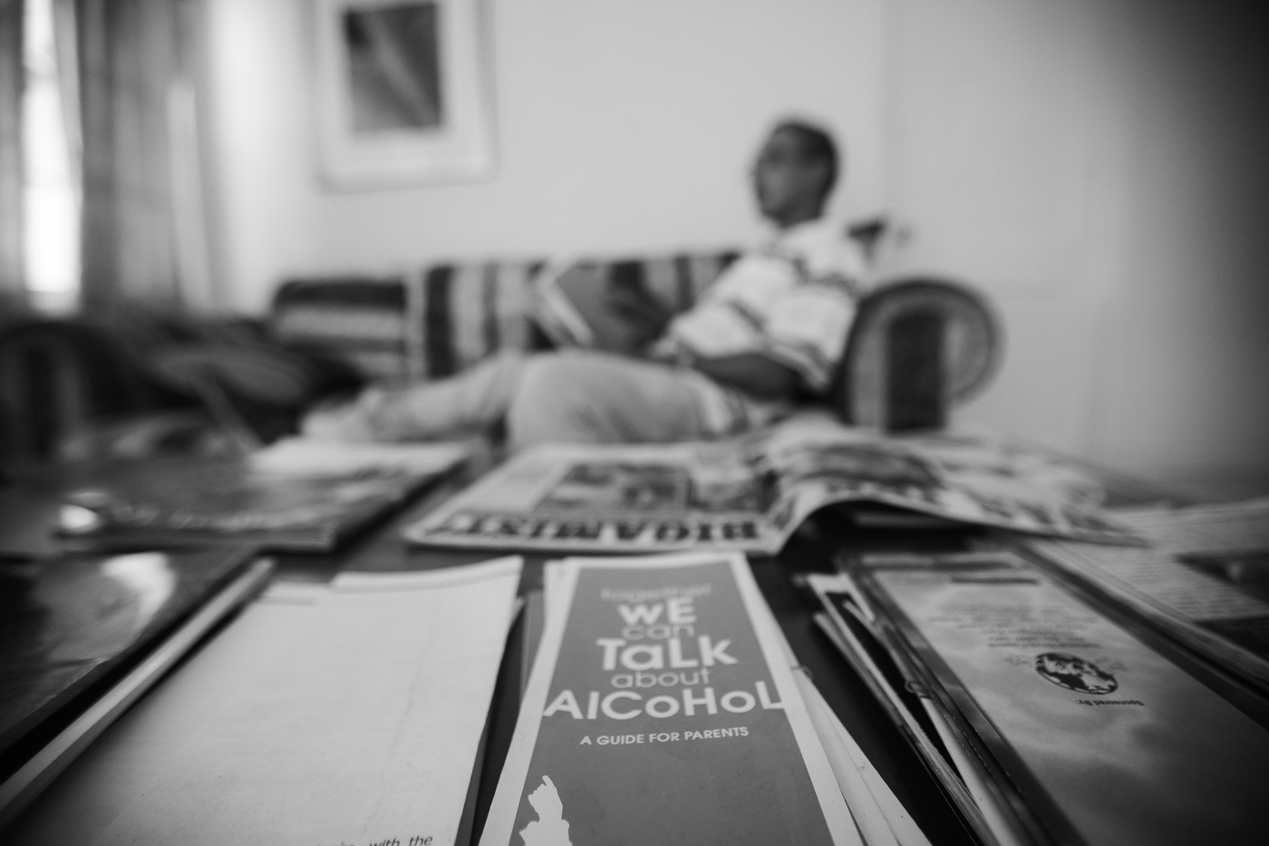 A resident reads a magazine at the Hope For Today Foundation, a transitional living facility for former addicts.